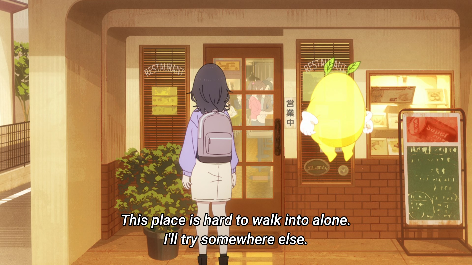 Mako standing in front of a busy restaurant, thinking it would be hard to walk into it alone
